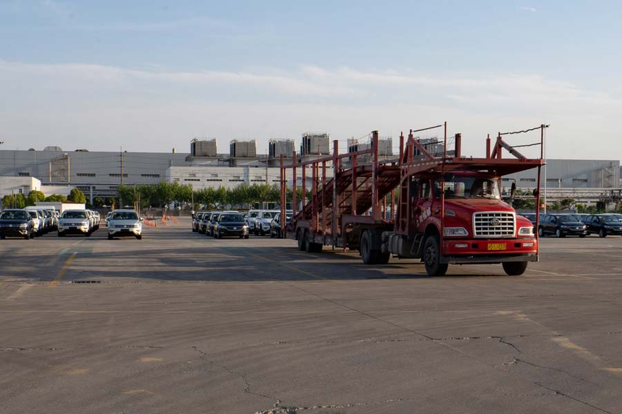 Cars waiting for loading onto truck.jpg